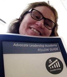 NM LEND Self-Advocacy fellow Laurel Deans with binder from Advocate Leadership Academy